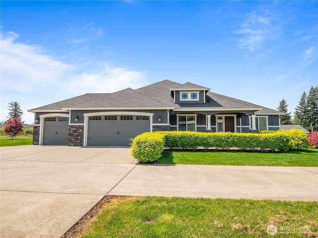 3420 Mchugh Pl, Enumclaw, WA 98022 - view of front facade featuring an attached garage, concrete driveway, a front lawn, and stone siding