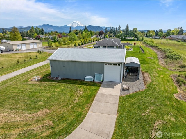 3420 Mchugh Pl, Enumclaw, WA 98022 - view of pole building featuring a yard, driveway, and a mountain view