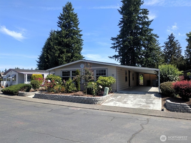 201 Union Ave SE Unit 92, Renton, WA 98059 - manufactured / mobile home with an attached carport and driveway