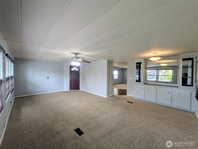 201 Union Ave SE Unit 92, Renton, WA 98059 - unfurnished living room featuring carpet and a ceiling fan