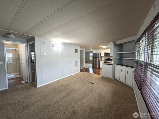 201 Union Ave SE Unit 92, Renton, WA 98059 - unfurnished living room with carpet flooring and baseboards