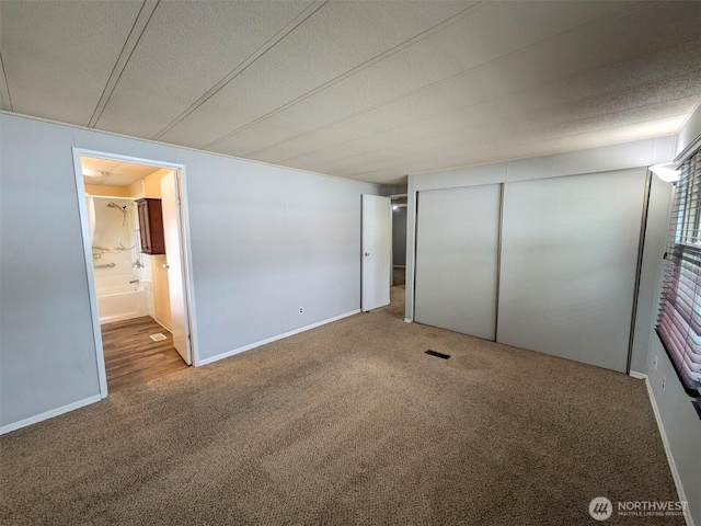 201 Union Ave SE Unit 92, Renton, WA 98059 - unfurnished bedroom with carpet flooring, connected bathroom, and a closet