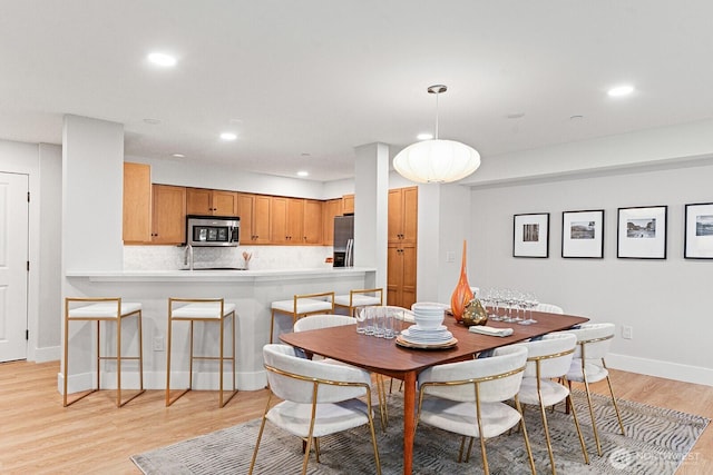 745 Bellevue Ave E Unit 201, Seattle, WA 98102 - dining space featuring light wood finished floors and recessed lighting