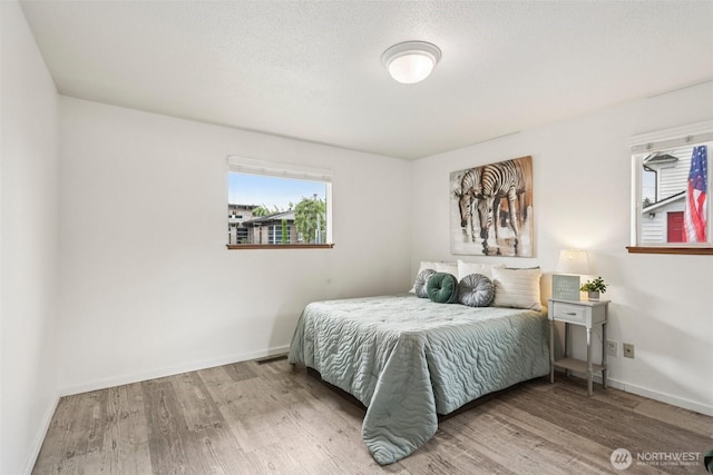 115 7th Ave SW, Puyallup, WA 98371 - bedroom with wood finished floors and baseboards