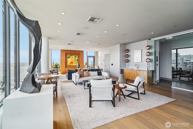 2510 6th Ave Unit 1010, Seattle, WA 98121 - living room with wood finished floors and recessed lighting