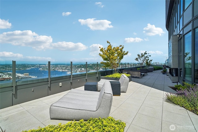 2510 6th Ave Unit 1010, Seattle, WA 98121 - view of patio / terrace with an outdoor living space and a water view