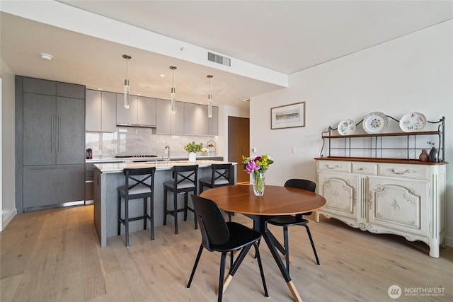 2510 6th Ave Unit 1010, Seattle, WA 98121 - dining room with light wood finished floors