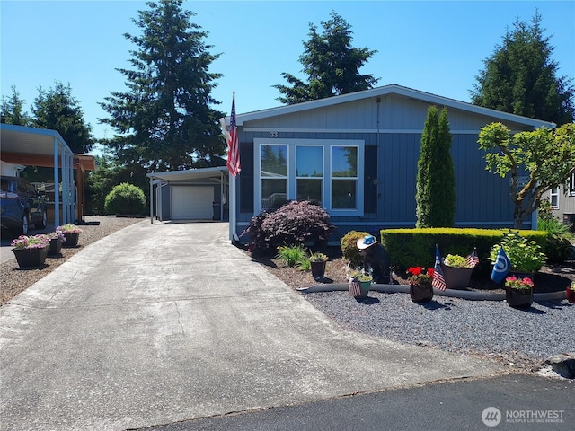 8430 15th Pl SE Unit 33, Lake Stevens, WA 98258 - manufactured / mobile home with concrete driveway and a carport