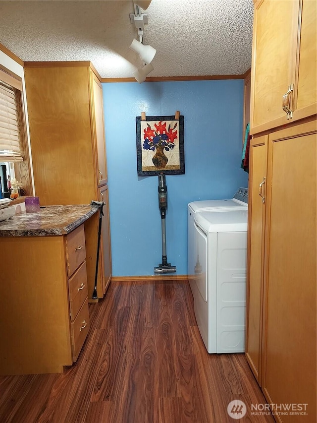 8430 15th Pl SE Unit 33, Lake Stevens, WA 98258 - laundry area with cabinet space, dark wood-style floors, washer and dryer, and a textured ceiling