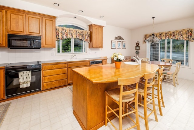 33571 Cliff Rd, Mount Vernon, WA 98274 - kitchen with stove, black microwave, a chandelier, a center island, and dishwasher
