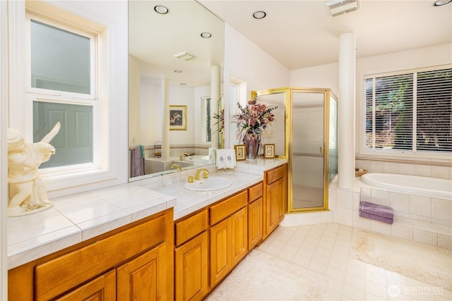 33571 Cliff Rd, Mount Vernon, WA 98274 - bathroom with vanity, a shower stall, a garden tub, tile patterned flooring, and recessed lighting