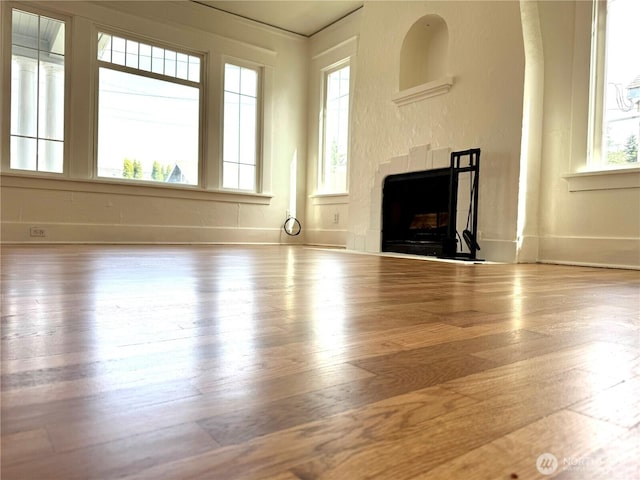 608 N Puget Sound Ave, Tacoma, WA 98406 - unfurnished living room with wood finished floors and a fireplace