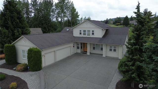 1218 Alpine View Dr, Mount Vernon, WA 98274 - view of front of house featuring a garage, concrete driveway, and covered porch