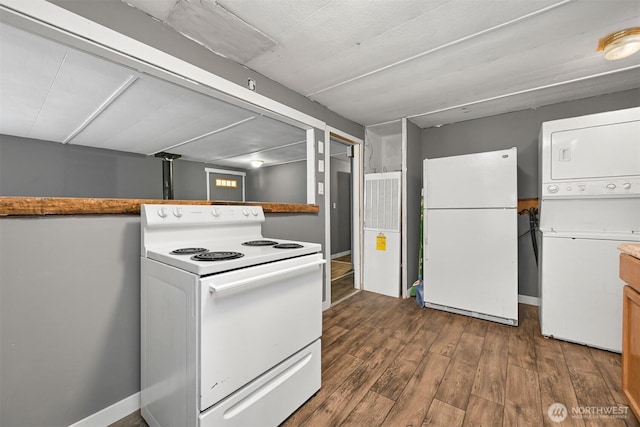 8283 Golden Valley Blvd, Maple Falls, WA 98266 - kitchen with white appliances, stacked washing machine and dryer, and dark wood finished floors