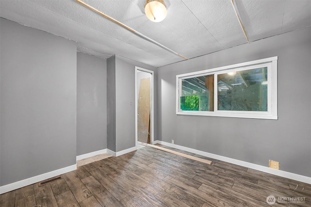 8283 Golden Valley Blvd, Maple Falls, WA 98266 - spare room featuring wood finished floors and a textured ceiling