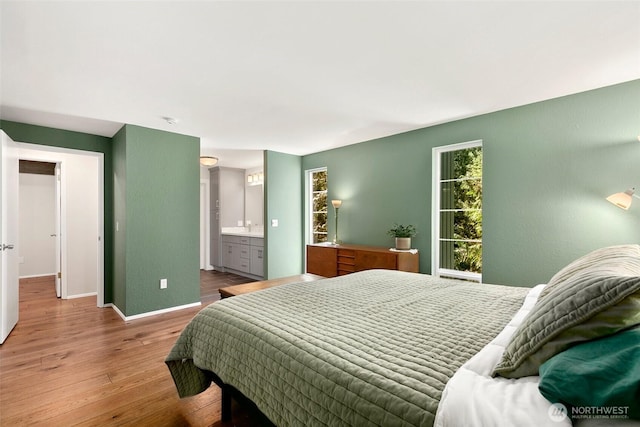 24016 SE 111th St, Issaquah, WA 98027 - bedroom featuring wood finished floors and baseboards