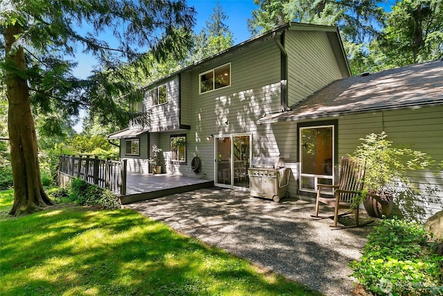 24016 SE 111th St, Issaquah, WA 98027 - rear view of property featuring a yard, a wooden deck, roof with shingles, and a patio area