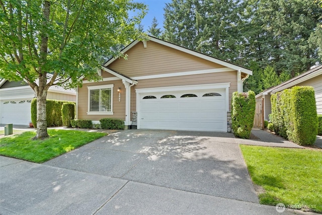 5221 Ivy Hill Ln SE, Lacey, WA 98513 - view of front facade featuring concrete driveway, an attached garage, and a front lawn