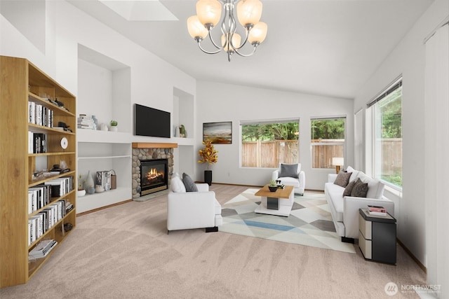 5221 Ivy Hill Ln SE, Lacey, WA 98513 - living area with healthy amount of natural light, lofted ceiling, a stone fireplace, a chandelier, and carpet flooring