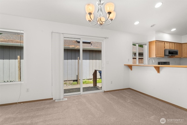5221 Ivy Hill Ln SE, Lacey, WA 98513 - unfurnished dining area featuring light colored carpet, healthy amount of natural light, a chandelier, and recessed lighting