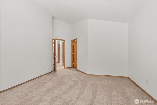 5221 Ivy Hill Ln SE, Lacey, WA 98513 - unfurnished room featuring light carpet and a towering ceiling