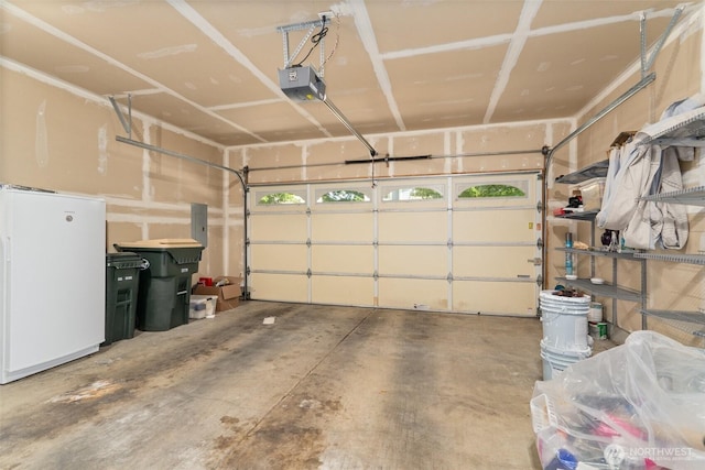 5221 Ivy Hill Ln SE, Lacey, WA 98513 - garage with freestanding refrigerator, a garage door opener, and electric panel