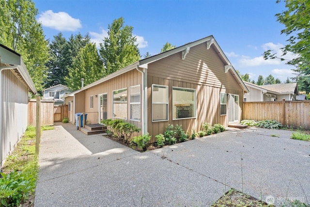 5221 Ivy Hill Ln SE, Lacey, WA 98513 - view of home's exterior with a patio area and a fenced backyard
