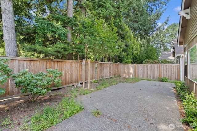 5221 Ivy Hill Ln SE, Lacey, WA 98513 - fenced backyard featuring a patio