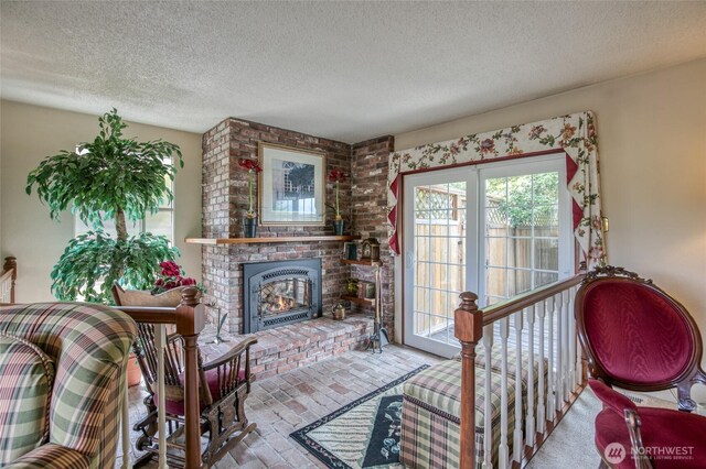 605 Lee Ave, Aberdeen, WA 98520 - living room with a textured ceiling, a brick fireplace, and brick flooring