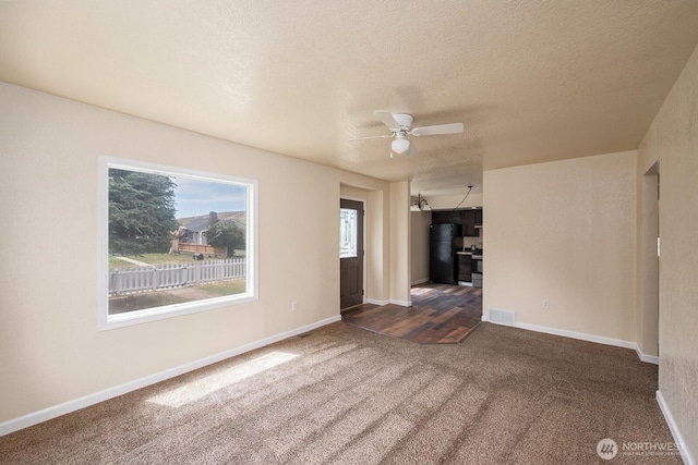 357 7th Ave SW, Ephrata, WA 98823 - unfurnished room with dark carpet, a ceiling fan, and a textured ceiling