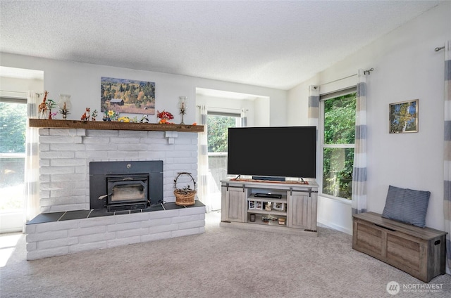 96 Kim Ct, Steilacoom, WA 98388 - living area featuring carpet, healthy amount of natural light, a wood stove, and a textured ceiling
