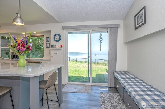 96 Kim Ct, Steilacoom, WA 98388 - dining space with wood finished floors and a textured ceiling