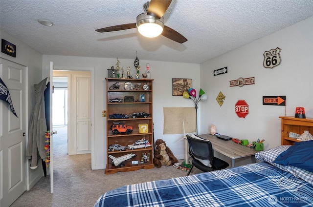 96 Kim Ct, Steilacoom, WA 98388 - carpeted bedroom featuring a textured ceiling and a ceiling fan