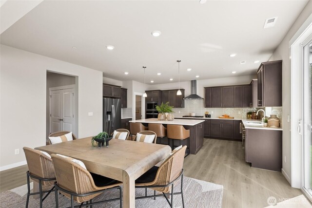 3828 98th Avenue Ct E Unit 10, Edgewood, WA 98371 - dining space with light wood-style floors and recessed lighting