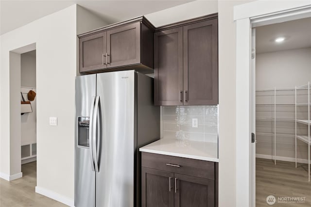 3828 98th Avenue Ct E Unit 10, Edgewood, WA 98371 - kitchen with stainless steel fridge with ice dispenser, light wood-type flooring, dark brown cabinetry, light countertops, and recessed lighting