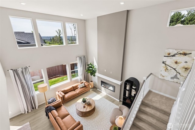 3828 98th Avenue Ct E Unit 10, Edgewood, WA 98371 - living room with a glass covered fireplace, light wood-type flooring, and recessed lighting