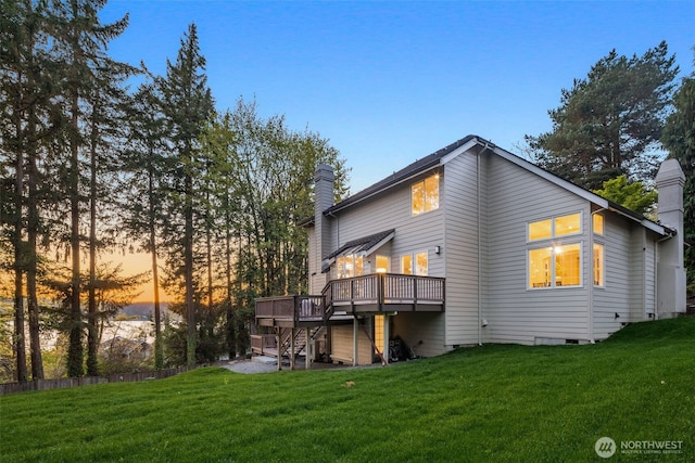 19221 SE 25th St, Sammamish, WA 98075 - back of property featuring a deck, a chimney, a lawn, and stairs