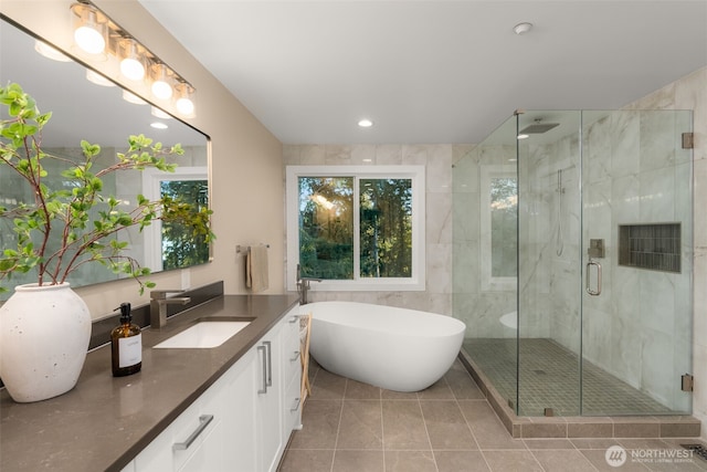 19221 SE 25th St, Sammamish, WA 98075 - full bath with vanity, a shower stall, a freestanding tub, recessed lighting, and tile patterned flooring