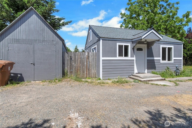 4050 E B St, Tacoma, WA 98404 - view of front of home featuring roof with shingles and a shed