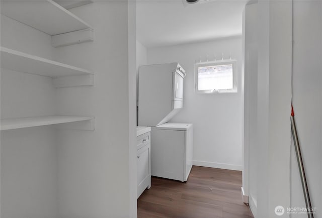 4050 E B St, Tacoma, WA 98404 - laundry area with stacked washing machine and dryer and dark wood-style flooring