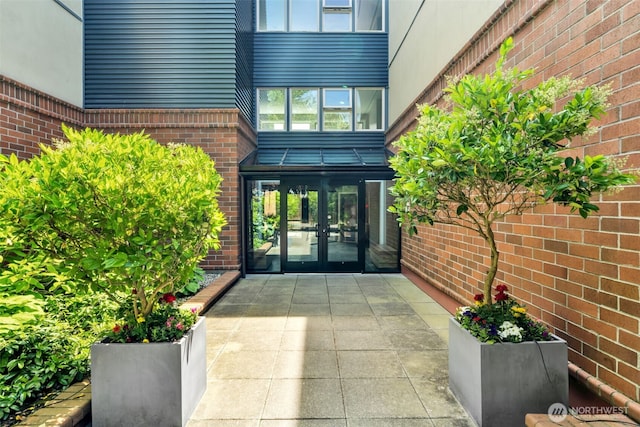 275 W Roy St Unit 319, Seattle, WA 98119 - doorway to property featuring french doors and brick siding