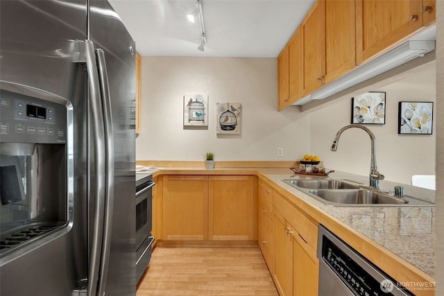 275 W Roy St Unit 319, Seattle, WA 98119 - kitchen with appliances with stainless steel finishes, light wood-style flooring, and track lighting