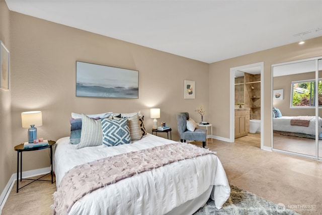 275 W Roy St Unit 319, Seattle, WA 98119 - bedroom with baseboards and ensuite bathroom