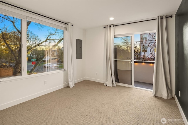 102 25th Ave Unit A, Seattle, WA 98122 - empty room featuring carpet flooring, healthy amount of natural light, electric panel, and recessed lighting