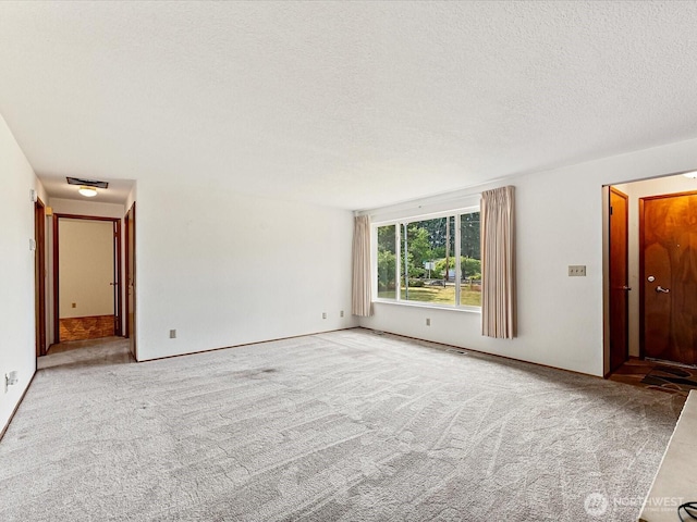 6702 120th St E, Puyallup, WA 98373 - empty room with carpet and a textured ceiling