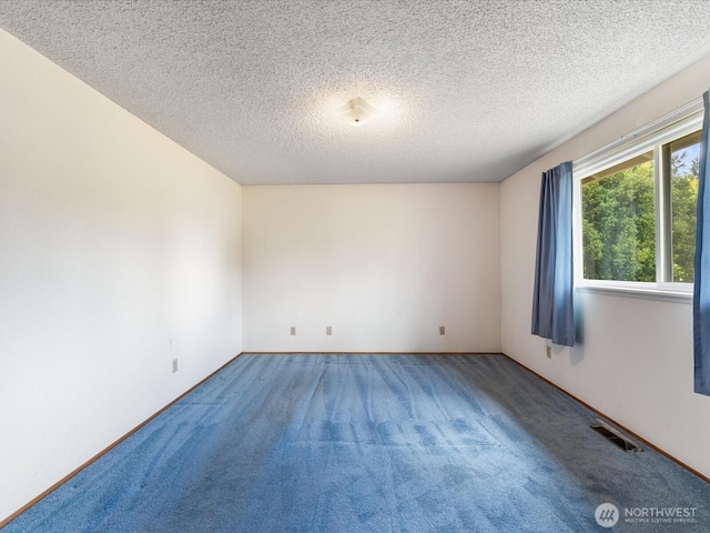 6702 120th St E, Puyallup, WA 98373 - unfurnished room featuring carpet flooring and a textured ceiling