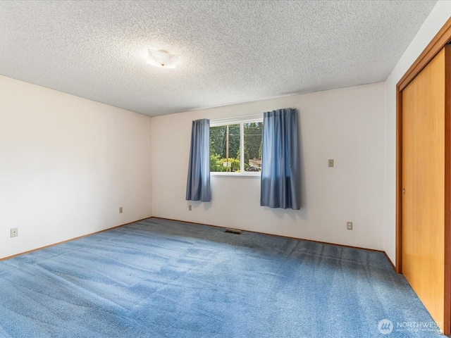 6702 120th St E, Puyallup, WA 98373 - carpeted empty room featuring a textured ceiling