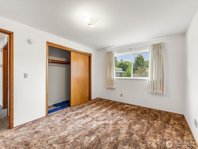 6702 120th St E, Puyallup, WA 98373 - unfurnished bedroom featuring carpet and a closet