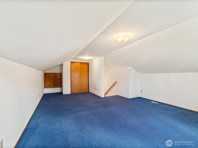 6702 120th St E, Puyallup, WA 98373 - additional living space with carpet flooring and vaulted ceiling