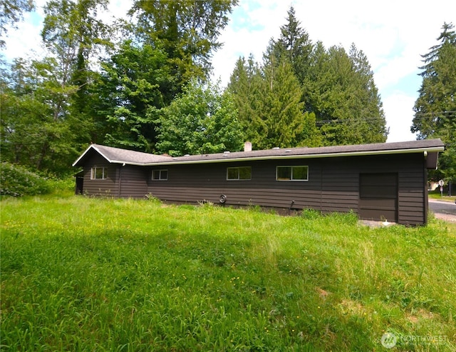 3428 99th Ave NE, Lake Stevens, WA 98258 - back of house with a chimney